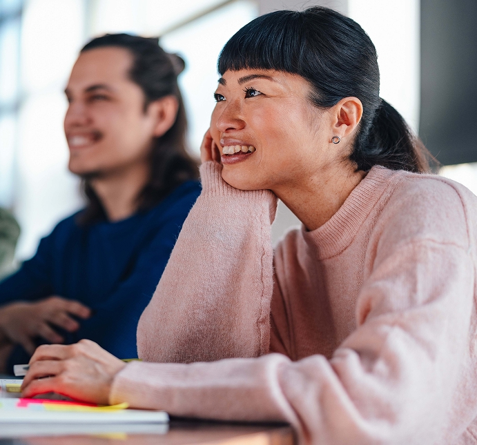 Woman smiling while using laptop