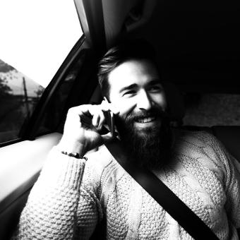 Uber hero image: Person in car smiling 