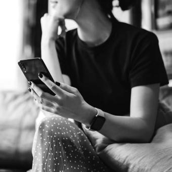 Woman using smartphone at home