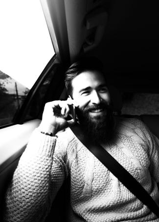 Uber hero image: Person in car smiling 
