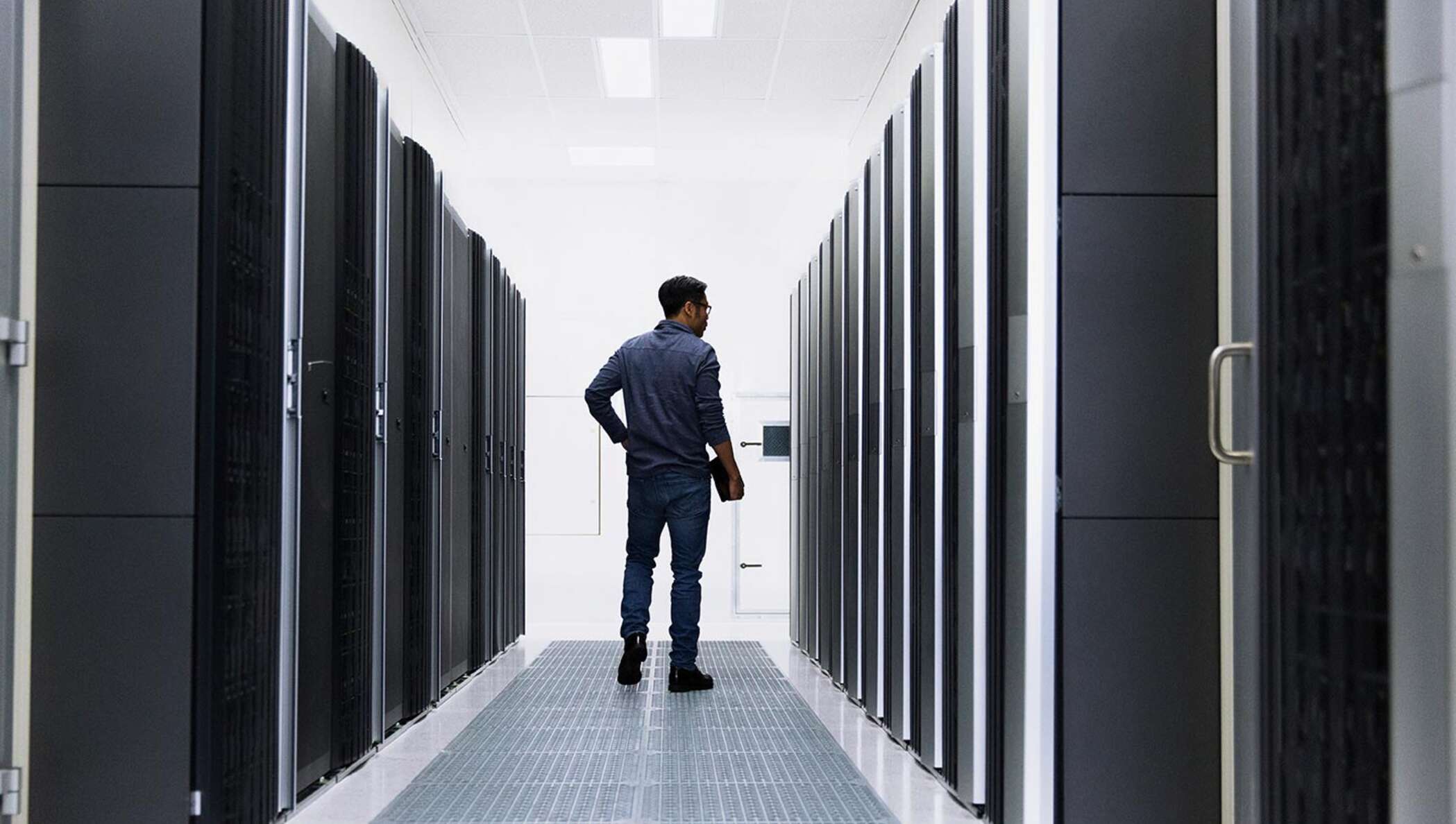 Man standing in a server room.